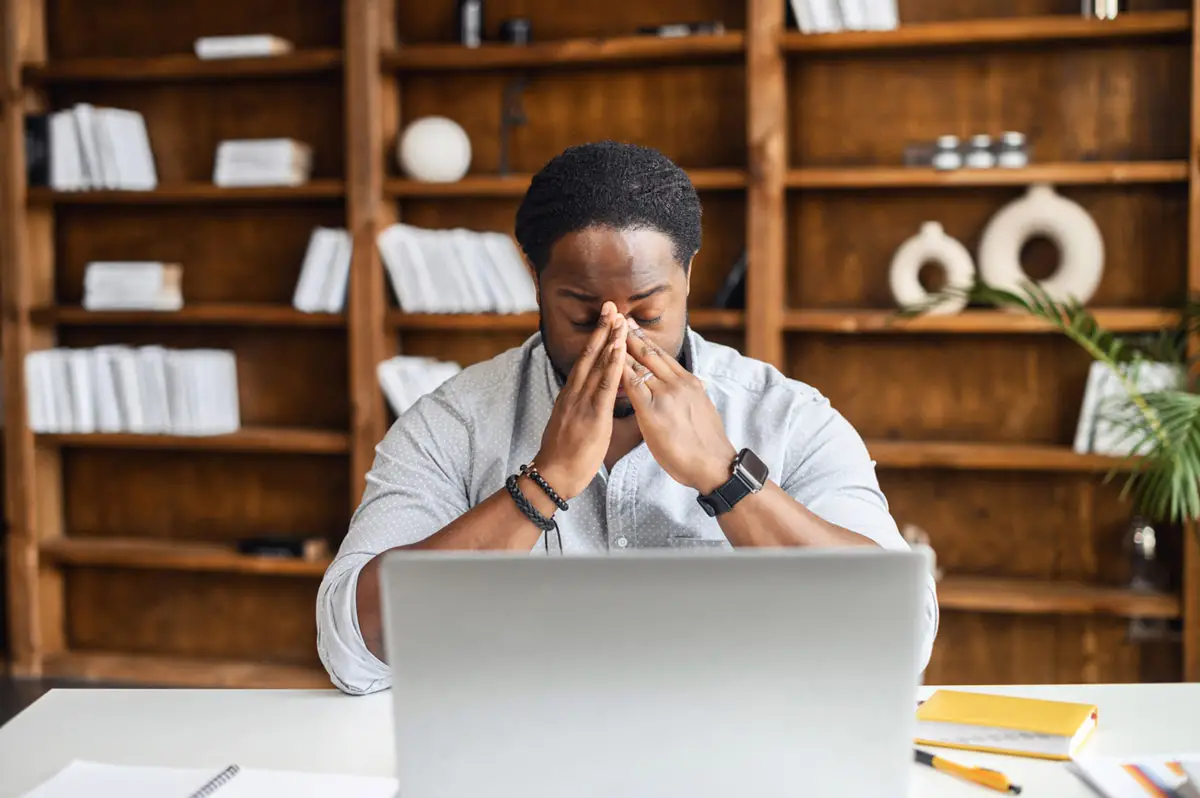 stressed out employer with too much on his plate